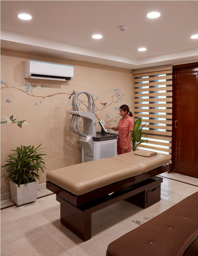 Aesthetician Checking Skin treatment Machine | Isya Aesthetics in Vasant Vihar, New Delhi