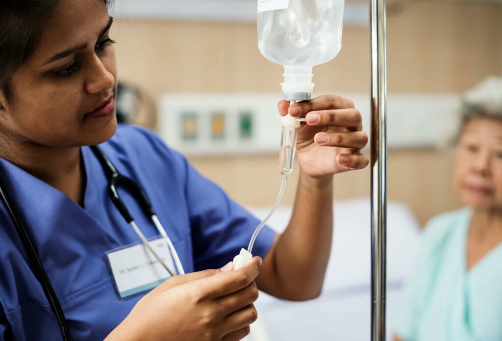 IV drops checking by nurse during IV Treatment | Isya Aesthetics in Vasant Vihar, Delhi