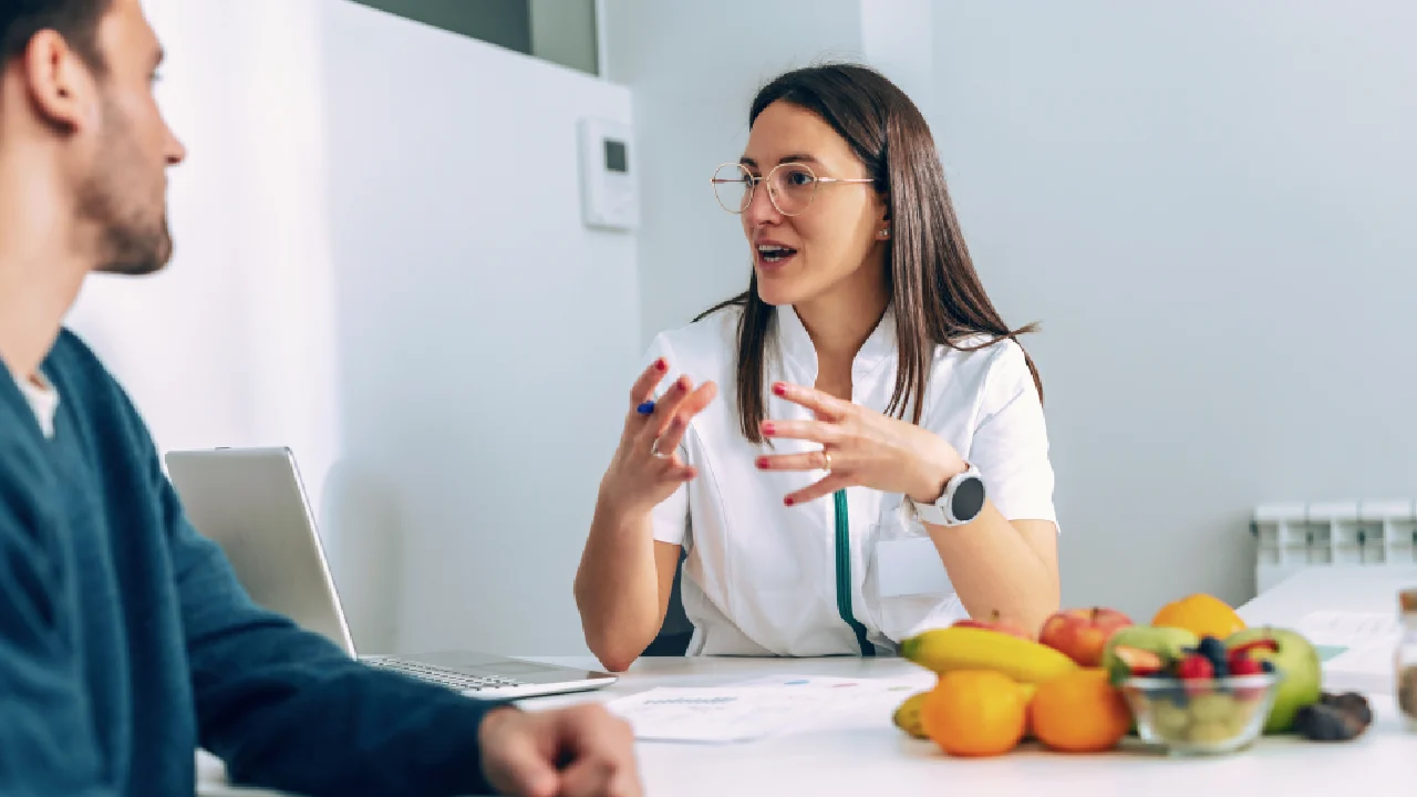 Doctor suggesting patient on diet plan for weight loss